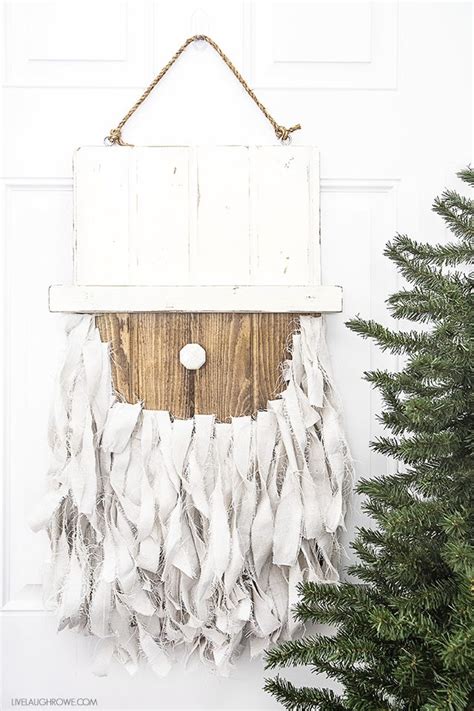 In addition to decorating the front door with a wreath, a sign or whatever else you prefer, there's also the option to put up a beautiful christmas tree on the porch. Rustic Santa Door Hanger | Christmas Door Decoration