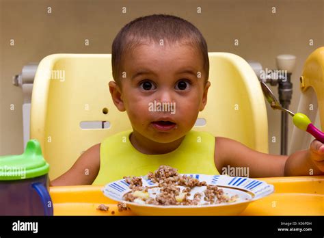 Baby Boy Eating Porridge Stock Photo Alamy