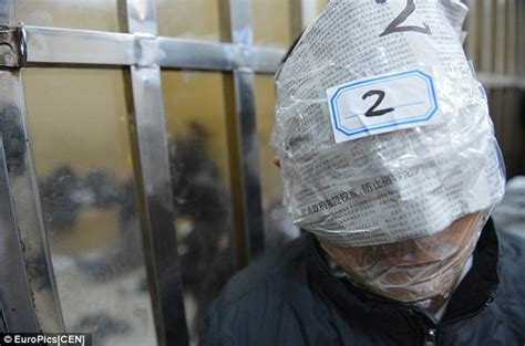 chinese crime suspects mouths taped up so they can t concoct alibis daily mail online