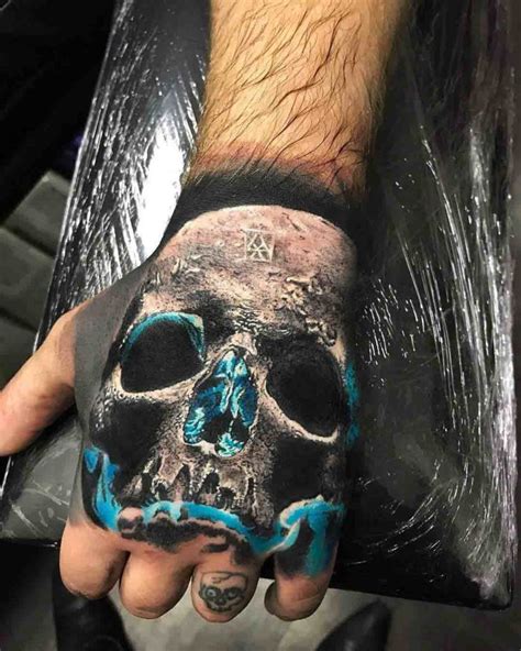 Blue Glow Skull Tattoo On Hand Best Tattoo Ideas Gallery