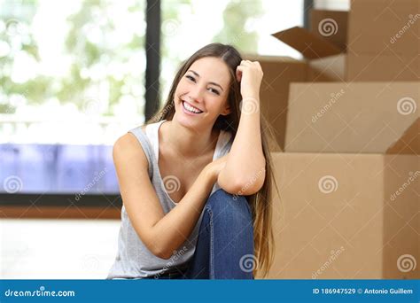 Happy Woman Moving Home Looking Camera Stock Image Image Of Living