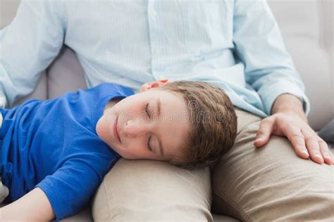 Father And Son Using Napping On The Couch Stock Photo Image Of Living Father