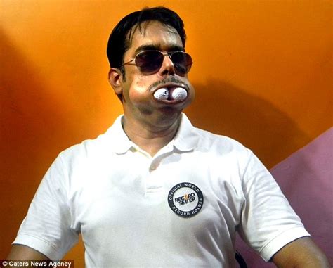 Dinesh Upadhyaya Holds 48 World Records For Stuffing Objects Into Mouth