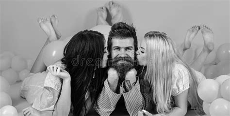 man with beard and mustache attracts blonde and brunette girls girls fall in love with macho