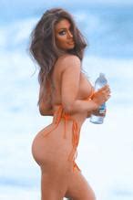 Paula Kalini Shows Off Her Curvy Beach Body While Posing In A Sexy