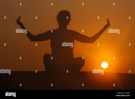 Sunset Meditation In The Desert Stock Photo Alamy