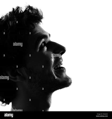 Young Man Looking Up Smiling Happy Portrait Silhouette In Studio
