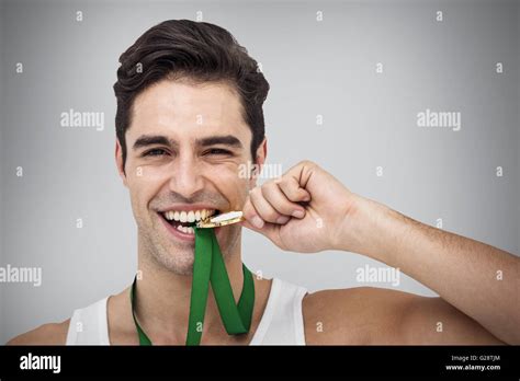 Composite Image Of Athlete Posing With Gold Medals Stock Photo Alamy