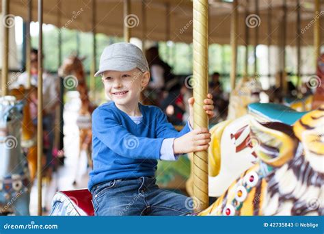 Boy At Carousel Stock Image Image Of Activity Cheerful 42735843