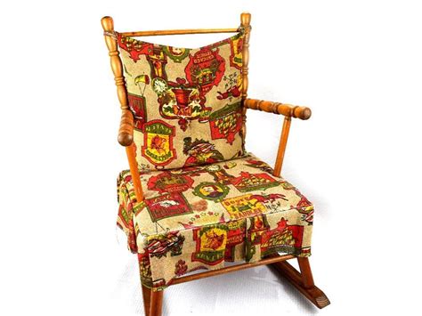 It features a wooden construction with a decorative, tall backrest and a deep seat, which. Child's Mid Century Wood Rocking Chair Early American ...