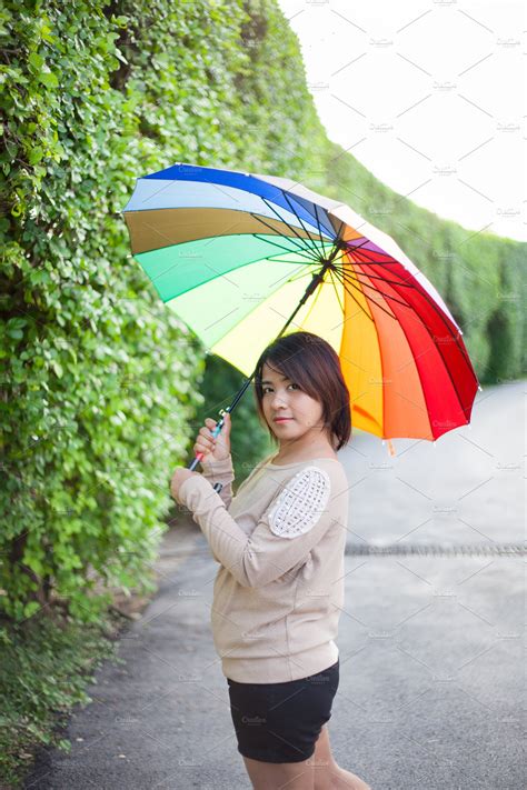 Asian Woman Holding An Umbrella ~ People Photos ~ Creative Market