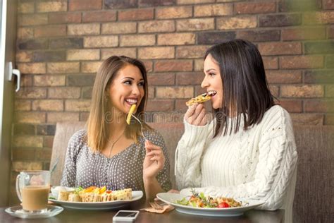 Two Girlfriends Having Lunch Together At A Restaurant Stock Image