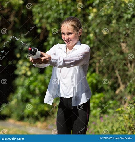 Wet Teenage Girl Squirts Water From Bottle Stock Photo Image Of Girl