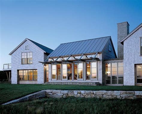 Modern Farmhouse Rancher With Lots Of Windows And Varied Roof Lines