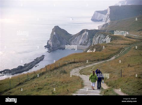 The Coastal Path With Walkers Near The Durdle Door Dorset England