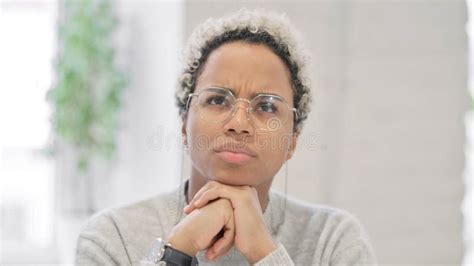 Close Up Of African Woman Thinking Stock Photo Image Of Serious