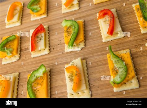 Freshly Made Snacks On Saltine Crackers With Assorted Sliced Cheese