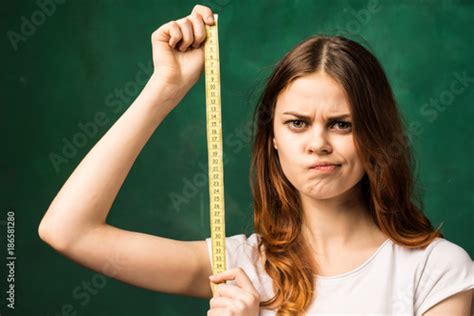 A Pretty Girl Is Annoyed She Is Holding A Ruler In Her Hand Buy This