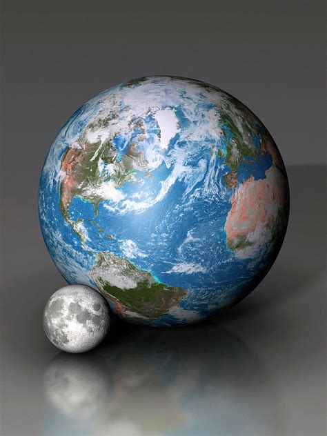 Earth And Moon Compared Photograph By Mark Garlick Science Photo Library