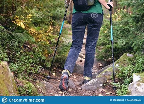 Woman Climbs In Hiking Boots In Outdoor Action Top View Of Boot On The