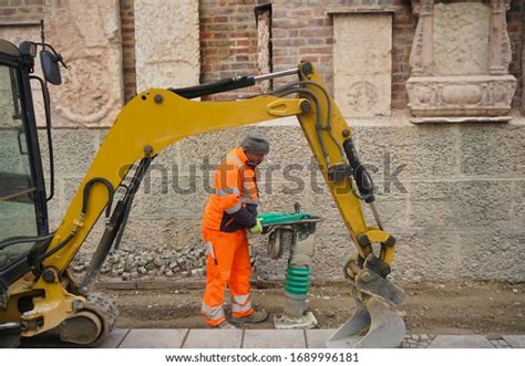 Male Worker Uniform Use Vibratory Plate Stock Photo 1689996181