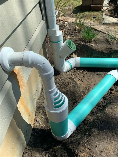 Sump Pump And Gutter Downspout Drainage System Draining Water Away
