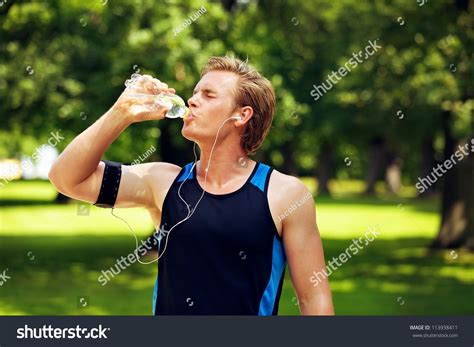 Thirsty Athlete Drinking Water After Workout Stock Photo 113938411