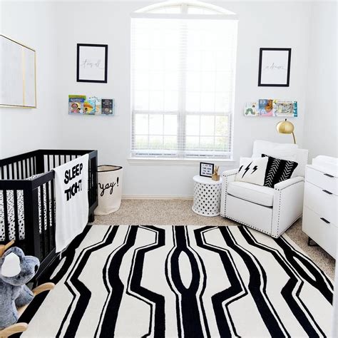 If you flip this and decide to go dark and moody, stick to draperies in equally dramatic tones for a super cohesive, polished look. Modern Black and White Nursery in 2020 | Rugs in living room, Living room sets, Room size rugs