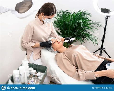 Doctor Cosmetologist Makes The Apparatus A Procedure Of Ultrasound