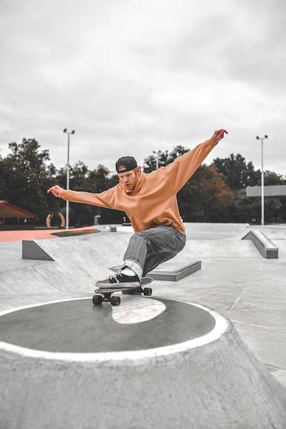 Premium Photo Guy On Skateboard Riding On Pedestal In Skatepark