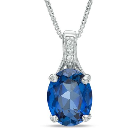 Oval Lab Created Blue Sapphire And Diamond Accent Pendant In Sterling