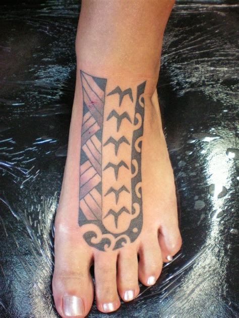 Cool ripped skin skeleton foot tattoo on man left foot. 16 Awesome Tribal Foot Tattoos | Only Tribal