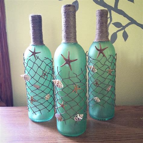 Beach Themed Wine Bottles With Starfish Seashells And Beach Netting