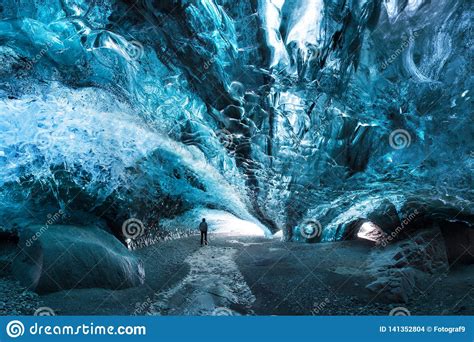 Man Silhouette In Ice Cave Blue Crystal Ice Cave And An Underground