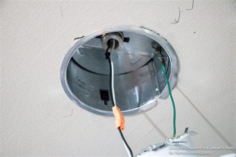 Pull the cable from the power source to the first recessed light and leave approximately 18 inches of wire hanging from the ceiling. Remodelaholic | How to Install Recessed Lights Without ...