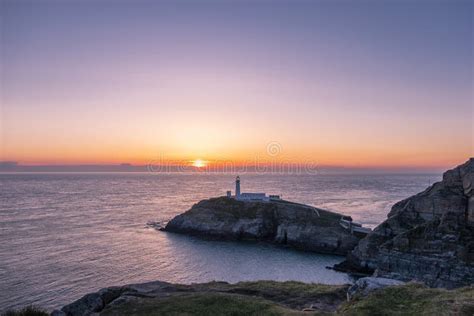 Sunset At South Stack Lighthouse On Anglesey In Wales Stock Image