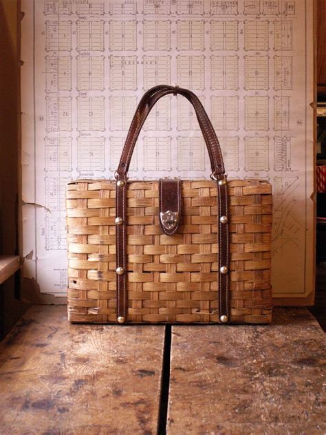 Lined with suede with a patch pocket and a jimmy choo label this noteworthy polished bag, crafted with leather featuring an intricately woven design, does dual work as a fashion adornment and factual necessity. Vintage Woven Tote Bag Purse with Brown Handles and Brass ...