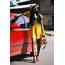 Beautiful Women In A Street Photoshoot Wearing Yellow Dress And Red 