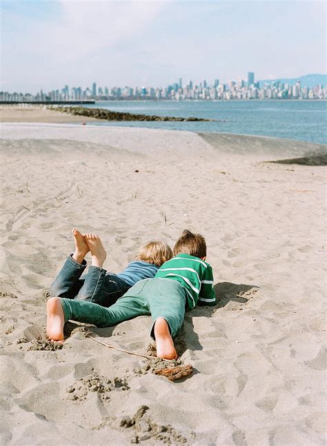 Boys Lying In Sand On Beach Vancouver Photograph By Kirill Bordon Pixels