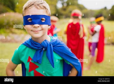 Little Boy Wearing Superhero Costume Posing For Camera Stock Photo Alamy