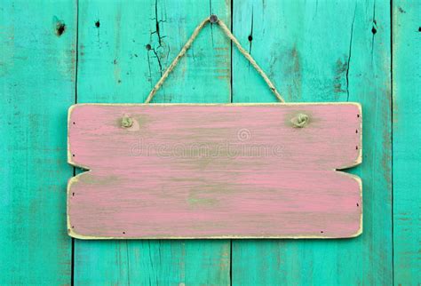 Distressed Pink Blank Sign Hanging On Antique Green Wooden