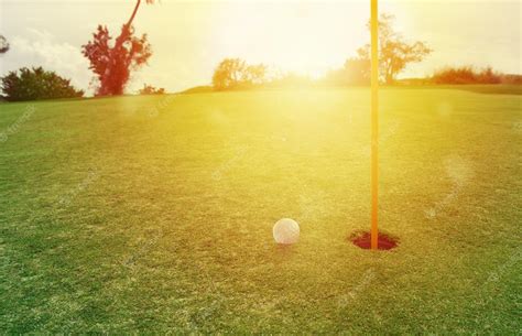 Premium Photo Golf Ball Near The Hole In A Grass Field