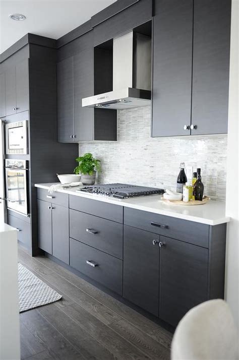 Metropolis dark quartz slab | arizona tile. Modern gray kitchen features dark gray flat front cabinets ...