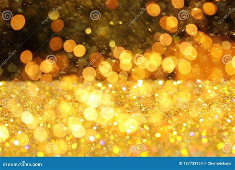 Luxury Golden Glitters On Background Bokeh Effect Stock Photo Image