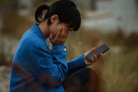 A Woman Crying With Her Smartphone In Her Hand Stock Image Image Of