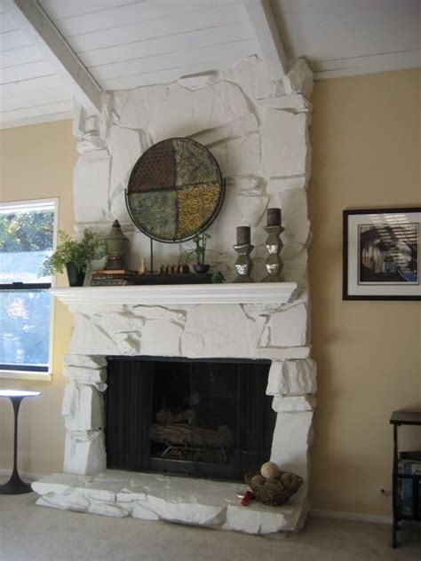 We renovated our fireplace and gave it a dramatic farmhouse style makeover with shiplap, a ledge stone surround, & new mantle. Do it Yourself Fireplace Remodels