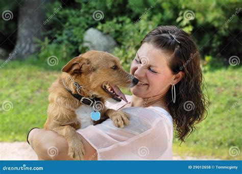 Young Adult Woman Holding Her Dog Stock Photo Image Of Sport