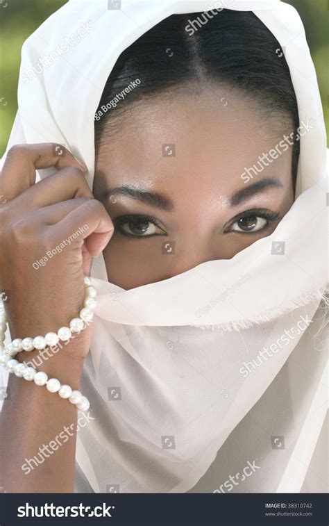 Muslim Islamic Woman Covering Face With Shawl Or Veil