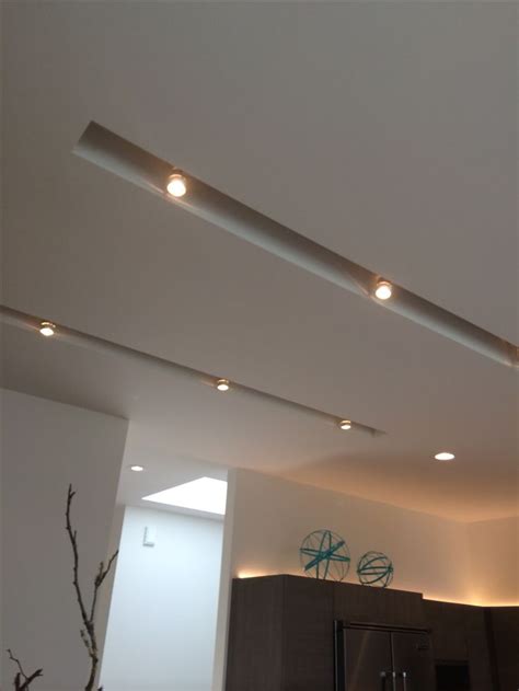 This is a photo that compares the flare off of recessed pot lights in a typical home. I love this use of recessed track lighting. It's supper ...