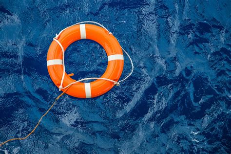 Safety Equipment Life Buoy Or Rescue Buoy Floating On Sea To Rescue